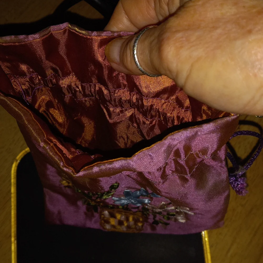 6x8 pretty detail flowers silky like material bag string closure.